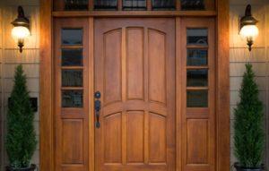 showing the wooden exterior door having with the knob on it. 