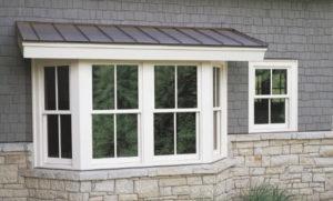 Exterior view of bay windows on a residential home.