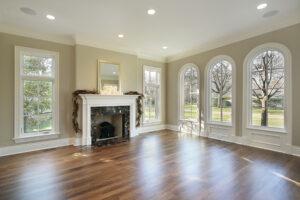 Living room in new construction home with marble fireplace