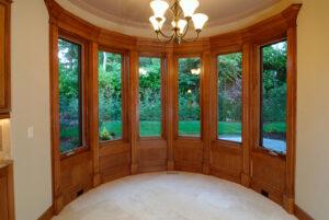 A set of wooden bow windows in a home